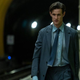 Matt Smith walking in a subway station
